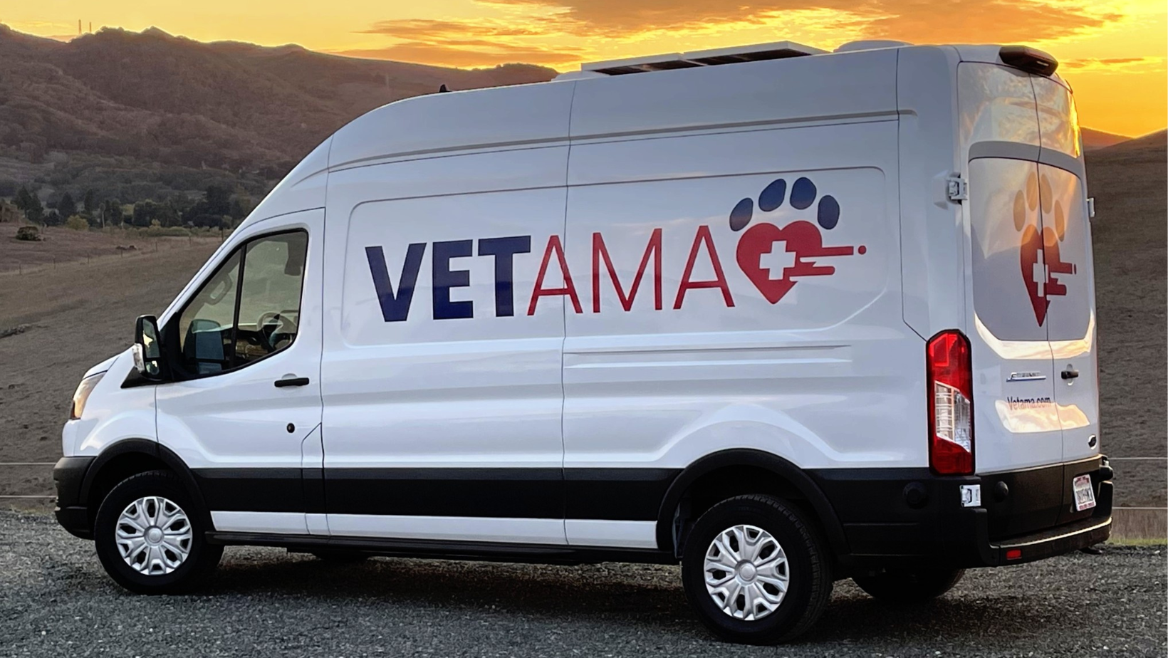A photo of a van with the Vetama logo parked in front of a sunset.